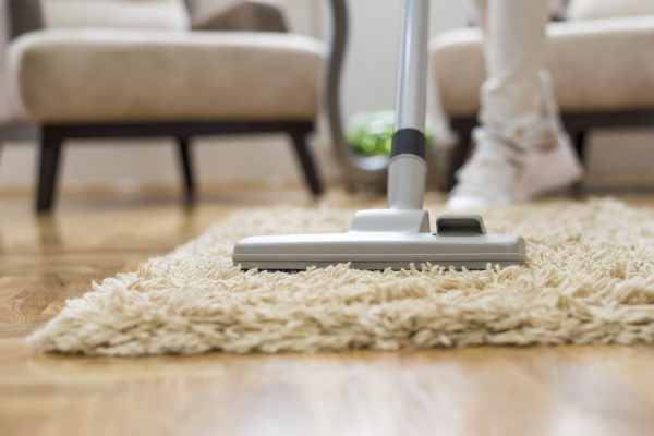 Closeup of a vacuum cleaner at a living room A closeup of a vacuum cleaner at a living room